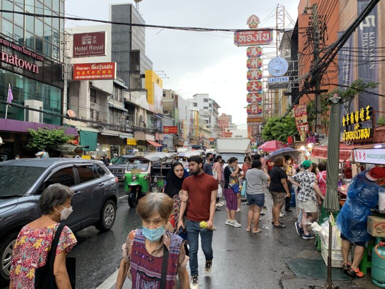 Daytime street life on Yaowarat Road in Bangkok Chinatown